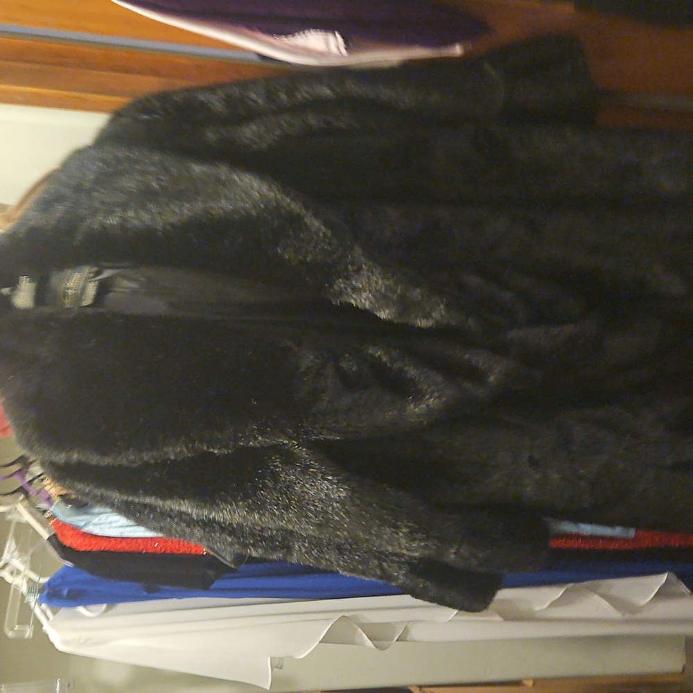 Terry Lewis, tiger Mills classic collection faux mink coat.